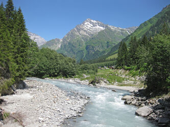 glacier milk river making its way to the valley